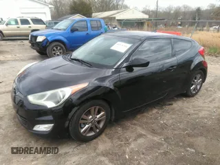 2013 Hyundai Veloster w/Black Int with VIN KMHTC6AD5DU097618, listed as a IAAI auction lot 41876394 with 159,519 mi miles. Bid and sale history available at carsss.com. Image 2.