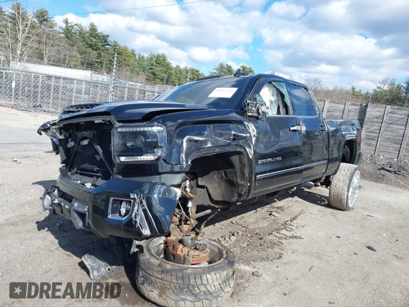2019 GMC Sierra 2500HD Denali z VIN 1GT12SEY3KF232018, wystawiony jako IAAI lot #41897434 z przebiegiem Nie podano mil oraz . Historia ofert i sprzedaży dostępna na DreamBid. Obrazek 2.