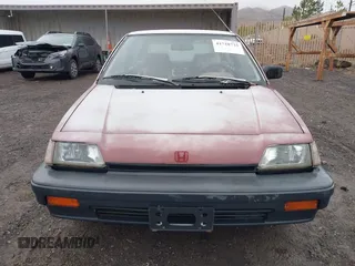 1987 Honda Civic z VIN JHMEC3427HS028239, wystawiony jako IAAI lot #41728725 z przebiegiem 113 710 mil mil oraz . Historia ofert i sprzedaży dostępna na DreamBid. Obrazek 6.