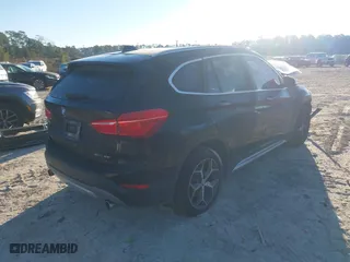 2019 BMW X1 sDrive28i with VIN WBXHU7C52K5L11560, listed as a IAAI auction lot 41354422 with 115,401 mi miles. Bid and sale history available at carsss.com. Image 4.