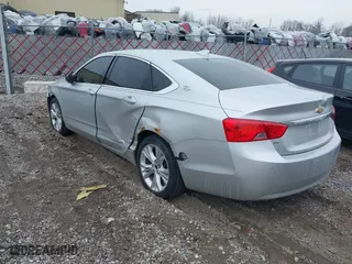 2015 Chevrolet Impala LT with VIN 1G1125S30FU138781, listed as a IAAI auction lot 41696424 with 150,239 mi miles. Bid and sale history available at carsss.com. Image 3.