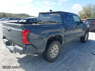 2024 Toyota Tacoma 4WD SR5 with VIN 3TYLB5JNXRT031852, listed as a IAAI auction lot 41779552 with 9,625 mi miles. Bid and sale history available at carsss.com. Image 4.