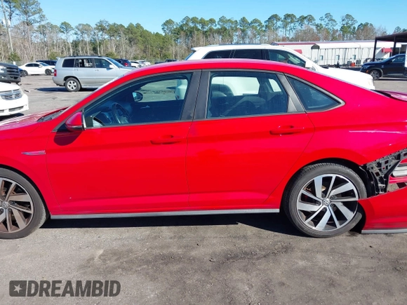 2019 Volkswagen Jetta GLI S z VIN 3VW5T7BU3KM225015, wystawiony jako IAAI lot #41352228 z przebiegiem 96 874 mil mil oraz . Historia ofert i sprzedaży dostępna na DreamBid. Obrazek 14.