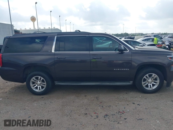 2015 Chevrolet Suburban LT with VIN 1GNSCJKCXFR175154, listed as a IAAI auction lot 42280418 with 227,373 mi miles and . Bid and sale history available at DreamBid. Image 13.