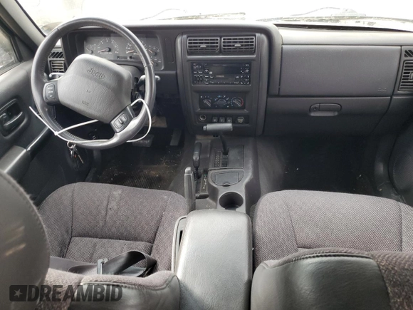 2001 Jeep Cherokee Sport z VIN 1J4FF58SX1L576572, wystawiony jako Copart lot #48982965 z przebiegiem 174 500 mil mil oraz Szkoda całkowita • Salvage title. Historia ofert i sprzedaży dostępna na DreamBid. Obrazek 8.