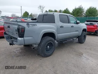 2021 Toyota Tacoma SR z VIN 3TMCZ5AN5MM372821, wystawiony jako IAAI lot #41886586 z przebiegiem 68 878 mil mil oraz . Historia ofert i sprzedaży dostępna na DreamBid. Obrazek 4.
