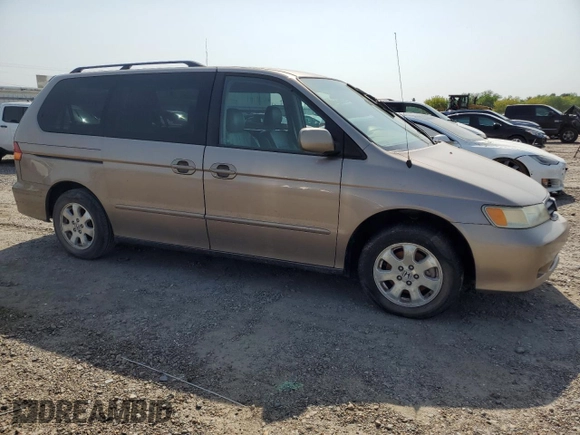 2004 Honda Odyssey EX-L with VIN 5FNRL18934B107378, listed as a Copart auction lot 51972795 with 186,043 mi miles and Salvage Title. Bid and sale history available at DreamBid. Image 4.