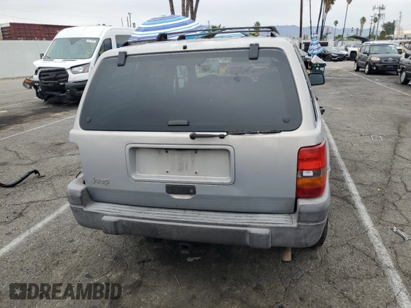 1997 Jeep Grand Cherokee Laredo with VIN 1J4GZ58S0VC771727, listed as a Copart auction lot 82233224 with 320,213 mi miles and Salvage Title. Bid and sale history available at carsss.com. Image 6.
