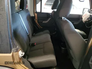 2015 Jeep Wrangler Unlimited Freedom with VIN 1C4BJWDG5FL713046, listed as a Copart auction lot 58563455 with 144,179 mi miles and Salvage title. Bid and sale history available at DreamBid. Image 11.