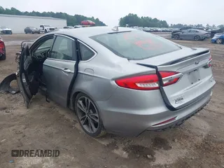 2020 Ford Fusion Titanium with VIN 3FA6P0D99LR138127, listed as a IAAI auction lot 42439024 with 128,792 mi miles and . Bid and sale history available at DreamBid. Image 3.