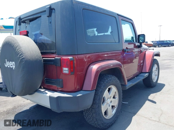 2010 Jeep Wrangler Sahara z VIN 1J4AA5D14AL125062, wystawiony jako IAAI lot #42418736 z przebiegiem 90 839 mil mil oraz . Historia ofert i sprzedaży dostępna na DreamBid. Obrazek 4.
