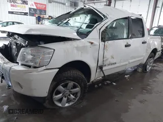 2013 Nissan Titan Pro-4X with VIN 1N6BA0EC7DN311469, listed as a IAAI auction lot 41945284 with 88,225 mi miles and . Bid and sale history available at DreamBid. Image 2.