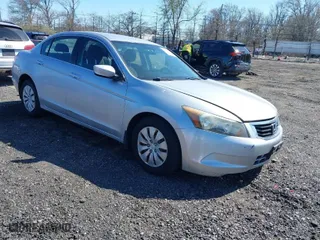 2009 Honda Accord Sdn LX with VIN 1HGCP26399A011061, listed as a IAAI auction lot 42043625 with 198,289 mi miles. Bid and sale history available at carsss.com. Image 1.