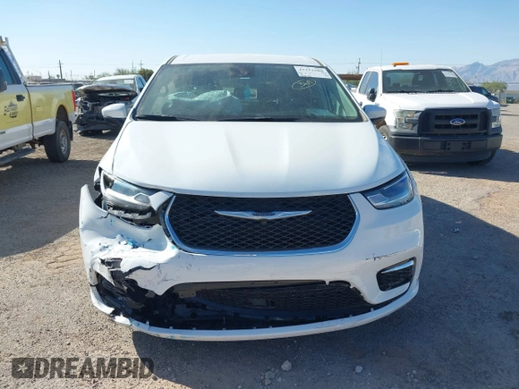 2023 Chrysler Pacifica Touring L with VIN 2C4RC1BG6PR531640, listed as a IAAI auction lot 42251680 with 31,638 mi miles and . Bid and sale history available at DreamBid. Image 12.