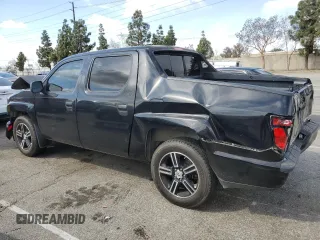 2014 Honda Ridgeline Sport with VIN 5FPYK1F7XEB008758, listed as a Copart auction lot 51022445 with 197,006 mi miles and Salvage title. Bid and sale history available at DreamBid. Image 2.