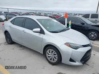 2018 Toyota Corolla L z VIN 5YFBURHE7JP822870, wystawiony jako IAAI lot #42318344 z przebiegiem 118 519 mil mil oraz . Historia ofert i sprzedaży dostępna na DreamBid. Obrazek 1.