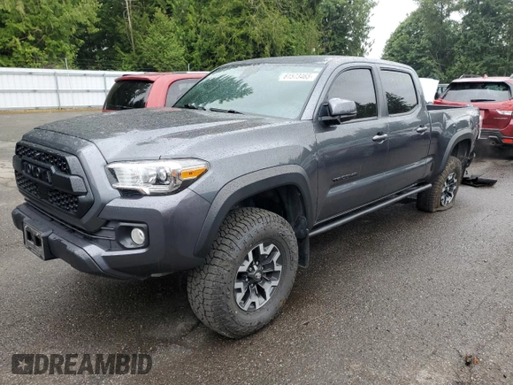 2020 Toyota Tacoma SR5 with VIN 3TMDZ5BN2LM097782, listed as a Copart auction lot 61573465 with 57,321 mi miles and Salvage title. Bid and sale history available at DreamBid. Image 1.