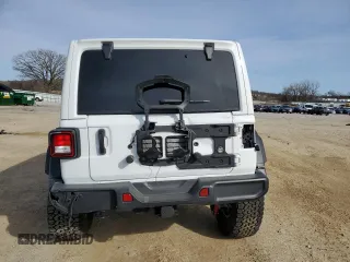 2023 Jeep Wrangler Sport S with VIN 1C4HJXDGXPW665818, listed as a Copart auction lot 48357105 with 9,803 mi miles and Clean Title. Bid and sale history available at DreamBid. Image 6.