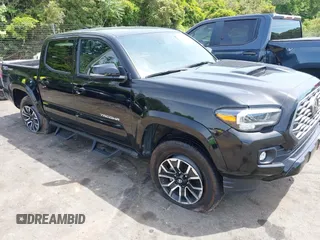 2023 Toyota Tacoma SR5 with VIN 3TMAZ5CN6PM197987, listed as a IAAI auction lot 42167960 with 26,395 mi miles and . Bid and sale history available at DreamBid. Image 1.