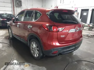 2013 Mazda CX-5 Grand Touring with VIN JM3KE2DE3D0120609, listed as a IAAI auction lot 41527942 with 215,176 mi miles. Bid and sale history available at carsss.com. Image 3.