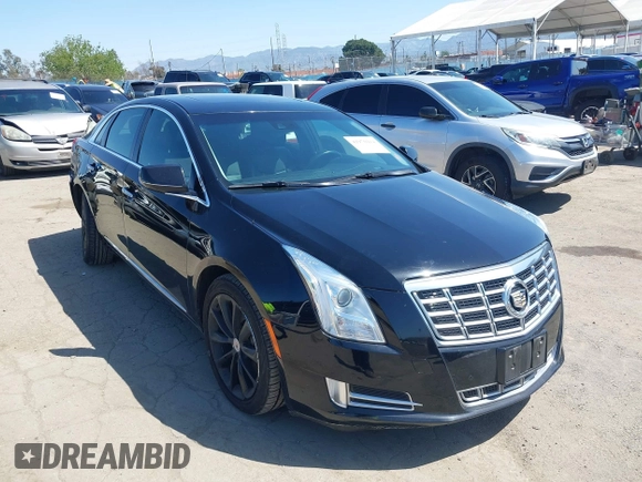 2013 Cadillac XTS Luxury z VIN 2G61P5S30D9220113, wystawiony jako IAAI lot #41970214 z przebiegiem 52 476 mil mil oraz . Historia ofert i sprzedaży dostępna na DreamBid. Obrazek 1.