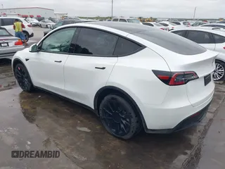 2022 Tesla Model Y Long Range z VIN 7SAYGDEE2NF420882, wystawiony jako IAAI lot #42023642 z przebiegiem 19 783 mil mil oraz . Historia ofert i sprzedaży dostępna na DreamBid. Obrazek 3.