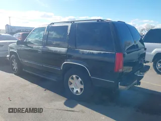 1997 GMC Yukon with VIN 1GKEK13R3VJ759103, listed as a IAAI auction lot 41726127 with 218,500 mi miles. Bid and sale history available at carsss.com. Image 3.