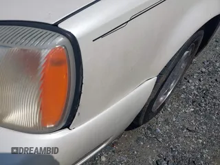 2001 Cadillac DeVille z VIN 1G6KD54Y91U197323, wystawiony jako IAAI lot #42251408 z przebiegiem Nie podano mil oraz . Historia ofert i sprzedaży dostępna na DreamBid. Obrazek 12.