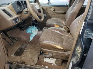 1991 Isuzu Trooper z VIN JACCH58E3M7900325, wystawiony jako Copart lot #79525294 z przebiegiem 146 593 mil mil oraz Czysty tytuł • Clean title. Historia ofert i sprzedaży dostępna na DreamBid. Obrazek 7.