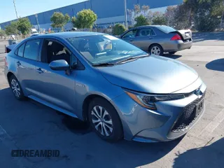 2021 Toyota Corolla Hybrid LE with VIN JTDEAMDE7MJ022674, listed as a IAAI auction lot 40293081 with 150,702 mi miles. Bid and sale history available at carsss.com. Image 1.