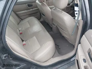 2004 Ford Taurus SEL with VIN 1FAHP56S44A129658, listed as a IAAI auction lot 41381122 with 298,335 mi miles. Bid and sale history available at carsss.com. Image 8.