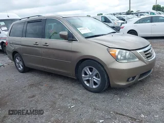 2008 Honda Odyssey Touring with VIN 5FNRL38988B097559, listed as a IAAI auction lot 42753521 with 201,018 mi miles and . Bid and sale history available at DreamBid. Image 1.