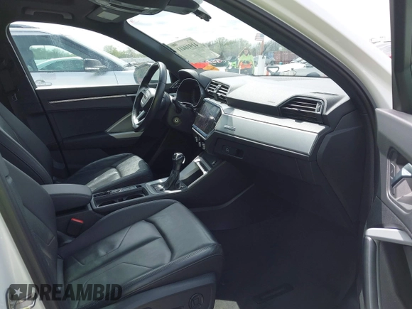 2021 Audi Q3 Premium with VIN WA1AUCF33M1096437, listed as a IAAI auction lot 41910411 with 86,837 mi miles and . Bid and sale history available at DreamBid. Image 5.