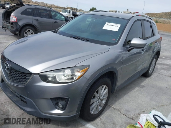 2014 Mazda CX-5 Touring with VIN JM3KE2CY3E0429025, listed as a IAAI auction lot 41680713 with 113,065 mi miles. Bid and sale history available at carsss.com. Image 2.
