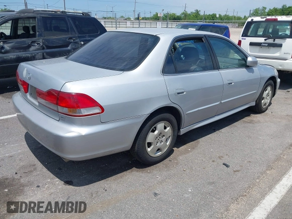 2001 Honda Accord EX z VIN 1HGCG165X1A058857, wystawiony jako IAAI lot #39264541 z przebiegiem 184 645 mil mil oraz . Historia ofert i sprzedaży dostępna na DreamBid. Obrazek 4.