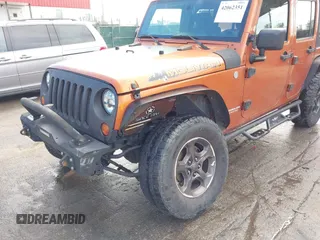 2010 Jeep Wrangler Unlimited Sport with VIN 1J4HA3H1XAL189667, listed as a IAAI auction lot 42062351 with 144,838 mi miles. Bid and sale history available at carsss.com. Image 6.
