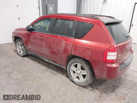 2010 Jeep Compass Sport with VIN 1J4NF4FB2AD506051, listed as a IAAI auction lot 41552084 with 218,785 mi miles. Bid and sale history available at carsss.com. Image 3.