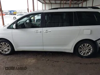 2014 Toyota Sienna XLE with VIN 5TDYK3DC6ES444121, listed as a IAAI auction lot 42110190 with 240,366 mi miles and . Bid and sale history available at DreamBid. Image 14.