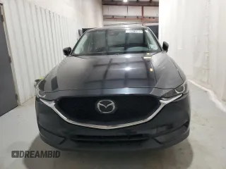 2021 Mazda CX-5 Touring with VIN JM3KFBCM5M0343577, listed as a Copart auction lot 52411005 with 70,372 mi miles and Clean Title. Bid and sale history available at carsss.com. Image 5.
