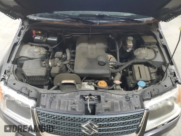 2012 Suzuki Grand Vitara Limited z VIN JS3TE0D78C4100383, wystawiony jako Copart lot #49240925 z przebiegiem 175 570 mil mil oraz Czysty tytuł • Clean title. Historia ofert i sprzedaży dostępna na DreamBid. Obrazek 12.