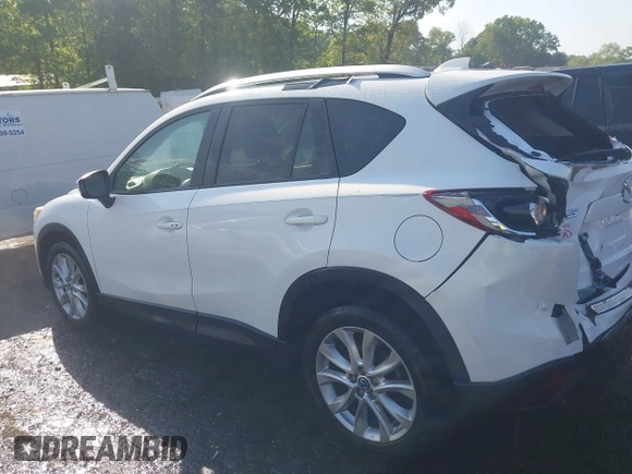2014 Mazda CX-5 Grand Touring with VIN JM3KE2DY1E0424890, listed as a IAAI auction lot 42052437 with 107,793 mi miles. Bid and sale history available at carsss.com. Image 14.