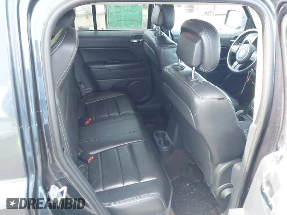2014 Jeep Patriot Latitude with VIN 1C4NJPFA9ED679293, listed as a IAAI auction lot 42078681 with 94,124 mi miles and . Bid and sale history available at DreamBid. Image 8.