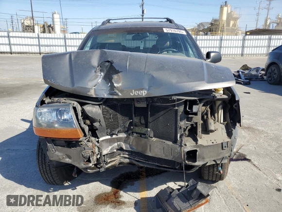 2000 Jeep Grand Cherokee Laredo with VIN 1J4G248S2YC377133, listed as a Copart auction lot 57916785 with 217,525 mi miles and Salvage title. Bid and sale history available at DreamBid. Image 5.