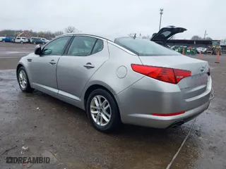 2011 Kia Optima LX with VIN KNAGM4A76B5146718, listed as a IAAI auction lot 42006225 with 213,939 mi miles. Bid and sale history available at carsss.com. Image 3.