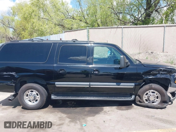 2003 Chevrolet Suburban LT z VIN 3GNGC26G83G210035, wystawiony jako IAAI lot #42084859 z przebiegiem 145 919 mil mil oraz . Historia ofert i sprzedaży dostępna na DreamBid. Obrazek 13.