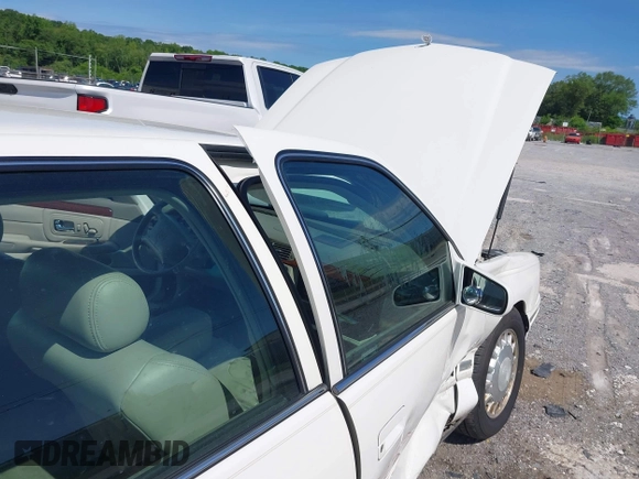 1999 Cadillac DeVille z VIN 1G6KD54Y3XU712969, wystawiony jako IAAI lot #42344041 z przebiegiem 169 572 mil mil oraz . Historia ofert i sprzedaży dostępna na DreamBid. Obrazek 13.