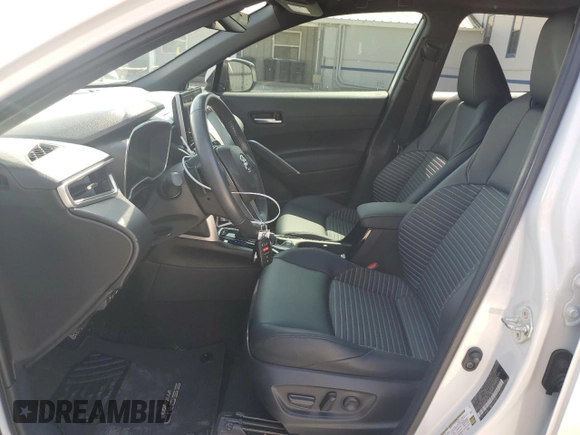 2023 Toyota Corolla Cross Hybrid S with VIN 7MUFBABG5PV008595, listed as a Copart auction lot 60002585 with 9,052 mi miles and Salvage title. Bid and sale history available at DreamBid. Image 7.