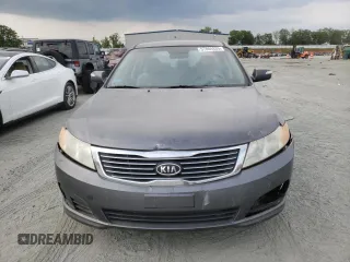 2009 Kia Optima LX z VIN KNAGE228695331919, wystawiony jako Copart lot #57804835 z przebiegiem 199 204 mil mil oraz Szkoda całkowita • Salvage title. Historia ofert i sprzedaży dostępna na DreamBid. Obrazek 5.