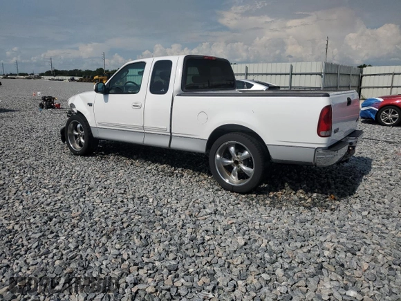 2002 Ford F-150 XL with VIN 1FTRX17272NB01218, listed as a Copart auction lot 61336795 with 201,972 mi miles and Salvage title. Bid and sale history available at DreamBid. Image 2.