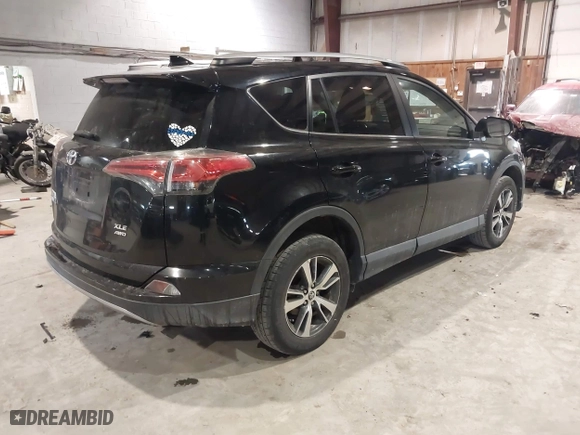 2017 Toyota RAV4 XLE with VIN 2T3RFREV0HW669312, listed as a IAAI auction lot 41410721 with 99,404 mi miles. Bid and sale history available at carsss.com. Image 4.